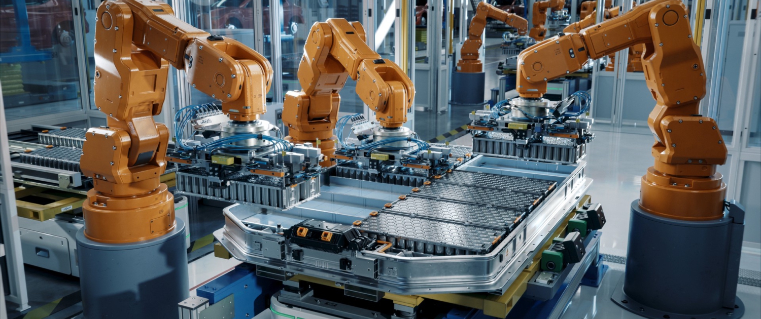 Advanced Orange Industrial Robot Arms Assemble EV Battery Pack on Automated Production Line. Row of Robotic Arms inside Automotive Plant Assemble Batteries. Modern Electric Car Smart Factory. Sale-and-Lease-back